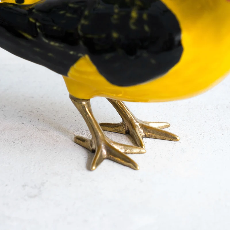Goldpirol mit Messingfüßen – Laboratório d'Estórias
